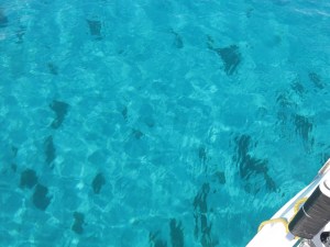 Crystal clear water beside boat
