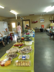 Potluck dinner being laid out