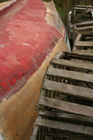 Lobster traps against boat hull